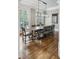 Elegant dining room with hardwood floors, large windows, and contemporary lighting at 604 Timm Valley Ne Rd # A, Atlanta, GA 30305