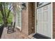 Inviting front porch with rocking chairs, brick flooring, and decorative windows at 604 Timm Valley Ne Rd # A, Atlanta, GA 30305