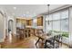 Open kitchen with an island, wood cabinets, stainless steel appliances, and a dining area at 604 Timm Valley Ne Rd # A, Atlanta, GA 30305