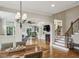 Open living room featuring hardwood floors, fireplace, and staircase at 604 Timm Valley Ne Rd # A, Atlanta, GA 30305