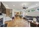 Open living room with hardwood floors, fireplace, and stairs leading to the second floor, plus a view to the kitchen at 604 Timm Valley Ne Rd # A, Atlanta, GA 30305