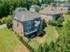 Spacious backyard featuring a well-maintained lawn, patio, and lush landscaping at 1393 Kings Park Nw Dr, Kennesaw, GA 30152