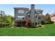 The home's backyard features a covered patio and a spacious lawn at 1393 Kings Park Nw Dr, Kennesaw, GA 30152