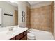Bathroom featuring a single sink vanity and a tiled shower-tub combo with fixtures at 1393 Kings Park Nw Dr, Kennesaw, GA 30152