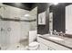 Modern bathroom featuring a glass-enclosed shower, granite countertop, and neutral tiled walls at 1393 Kings Park Nw Dr, Kennesaw, GA 30152