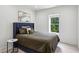 Cozy bedroom with a comfortable bed and natural light at 1393 Kings Park Nw Dr, Kennesaw, GA 30152