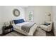 Cozy bedroom featuring a comfortable bed, stylish decor, and a sunlit window at 1393 Kings Park Nw Dr, Kennesaw, GA 30152