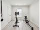 Dedicated workout space featuring a stationary bike, rowing machine, and wall-mounted equipment at 1393 Kings Park Nw Dr, Kennesaw, GA 30152