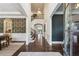Grand foyer with soaring ceilings and hardwood floors leads to a staircase and formal dining area at 1393 Kings Park Nw Dr, Kennesaw, GA 30152