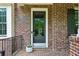 Close-up of a front door with brick facade and charming details at 1393 Kings Park Nw Dr, Kennesaw, GA 30152