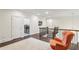 Upstairs hallway sitting area with modern lighting, hardwood floors, and comfortable seating at 1393 Kings Park Nw Dr, Kennesaw, GA 30152