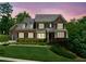 Stunning home featuring a well-manicured lawn and mature landscaping, offering great curb appeal at 1393 Kings Park Nw Dr, Kennesaw, GA 30152