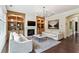 Bright living room with a fireplace, built-in shelving, and hardwood floors for a touch of elegance at 1393 Kings Park Nw Dr, Kennesaw, GA 30152