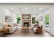 Inviting living room with a brick fireplace, recessed lighting, and a comfortable seating arrangement at 1393 Kings Park Nw Dr, Kennesaw, GA 30152