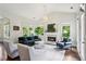 Elegant living room with a fireplace and plenty of natural light at 1393 Kings Park Nw Dr, Kennesaw, GA 30152