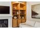Comfortable living space features a fireplace, built-in shelving, and a mounted television at 1393 Kings Park Nw Dr, Kennesaw, GA 30152
