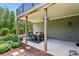 Inviting covered patio with an outdoor dining area and views of a beautifully landscaped yard at 1393 Kings Park Nw Dr, Kennesaw, GA 30152