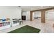 Spacious playroom with brick archways and built-in shelving at 1393 Kings Park Nw Dr, Kennesaw, GA 30152
