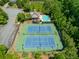 Community tennis courts and pool area with mature landscaping at 1393 Kings Park Nw Dr, Kennesaw, GA 30152
