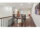 Upstairs hallway featuring hardwood floors and a wrought iron railing at 1393 Kings Park Nw Dr, Kennesaw, GA 30152