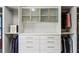 Well-lit closet featuring drawers, cabinets, and rods, providing a modern and efficient storage solution at 1393 Kings Park Nw Dr, Kennesaw, GA 30152