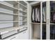 Organized walk-in closet with custom shelving, drawers, and clothing racks for ample storage at 1393 Kings Park Nw Dr, Kennesaw, GA 30152