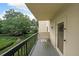 Private balcony featuring a charming seating area with views of the landscaped grounds at 1800 Clairmont Lk # 213, Decatur, GA 30033