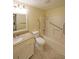 Accessible bathroom with safety bars, granite countertop vanity, and tiled floor at 1800 Clairmont Lk # 213, Decatur, GA 30033