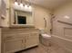Clean bathroom featuring granite vanity, tile floor, and accessible shower at 1800 Clairmont Lk # 213, Decatur, GA 30033