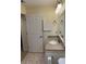 Bathroom features a granite countertop, tile floor, and vanity with storage space at 1800 Clairmont Lk # 213, Decatur, GA 30033