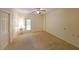 Empty bedroom with neutral carpet, multiple doors, and a ceiling fan at 1800 Clairmont Lk # 213, Decatur, GA 30033