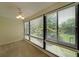 Sun-lit bedroom featuring large windows, neutral walls and carpet, plus a ceiling fan at 1800 Clairmont Lk # 213, Decatur, GA 30033
