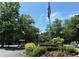 Scenic community view with a lake, gazebo, landscaping, and an American flag at 1800 Clairmont Lk # 213, Decatur, GA 30033