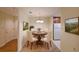 Cozy dining area with chandelier, artwork, and adjacent kitchen at 1800 Clairmont Lk # 213, Decatur, GA 30033