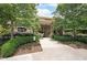Beautiful entrance to 2100 Clairmont Lake with lush landscaping and trees surrounding the brick building at 1800 Clairmont Lk # 213, Decatur, GA 30033