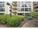Apartment building exterior with balconies, large windows, and manicured landscaping at 1800 Clairmont Lk # 213, Decatur, GA 30033