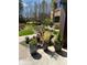 Home exterior with flowerpots, showing manicured lawn and manicured trees at 1800 Clairmont Lk # 213, Decatur, GA 30033