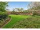 Exterior of building with a sprawling green lawn and manicured hedges at 1800 Clairmont Lk # 213, Decatur, GA 30033