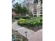 Building exterior with landscaped gardens and walking path at 1800 Clairmont Lk # 213, Decatur, GA 30033