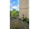 Beautifully landscaped garden with elegant statue, lush plants, and manicured hedges at 1800 Clairmont Lk # 213, Decatur, GA 30033