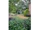 Beautiful garden path with lush greenery and a white decorative archway at 1800 Clairmont Lk # 213, Decatur, GA 30033