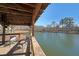 View of the pond from inside the gazebo with chairs and a serene setting at 1800 Clairmont Lk # 213, Decatur, GA 30033