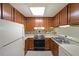 Efficient kitchen with white appliances and ample cabinet storage at 1800 Clairmont Lk # 213, Decatur, GA 30033