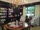 Cozy library with book-lined shelves and comfortable seating next to a bright window at 1800 Clairmont Lk # 213, Decatur, GA 30033