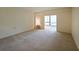 This spacious living room boasts plush carpeting and a large window for ample natural light at 1800 Clairmont Lk # 213, Decatur, GA 30033