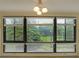 View from living room windows of lush green lawn and mature trees in the community at 1800 Clairmont Lk # 213, Decatur, GA 30033