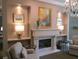 Elegant living room with fireplace, chandelier, and recessed lighting at 1800 Clairmont Lk # 213, Decatur, GA 30033