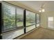 Sunlit living room featuring large windows with peaceful views of the lush green landscape at 1800 Clairmont Lk # 213, Decatur, GA 30033