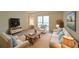 Bright living room with neutral tones, comfortable seating, and natural light at 1800 Clairmont Lk # 213, Decatur, GA 30033