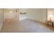 Living room featuring neutral carpet and an adjoining dining area at 1800 Clairmont Lk # 213, Decatur, GA 30033